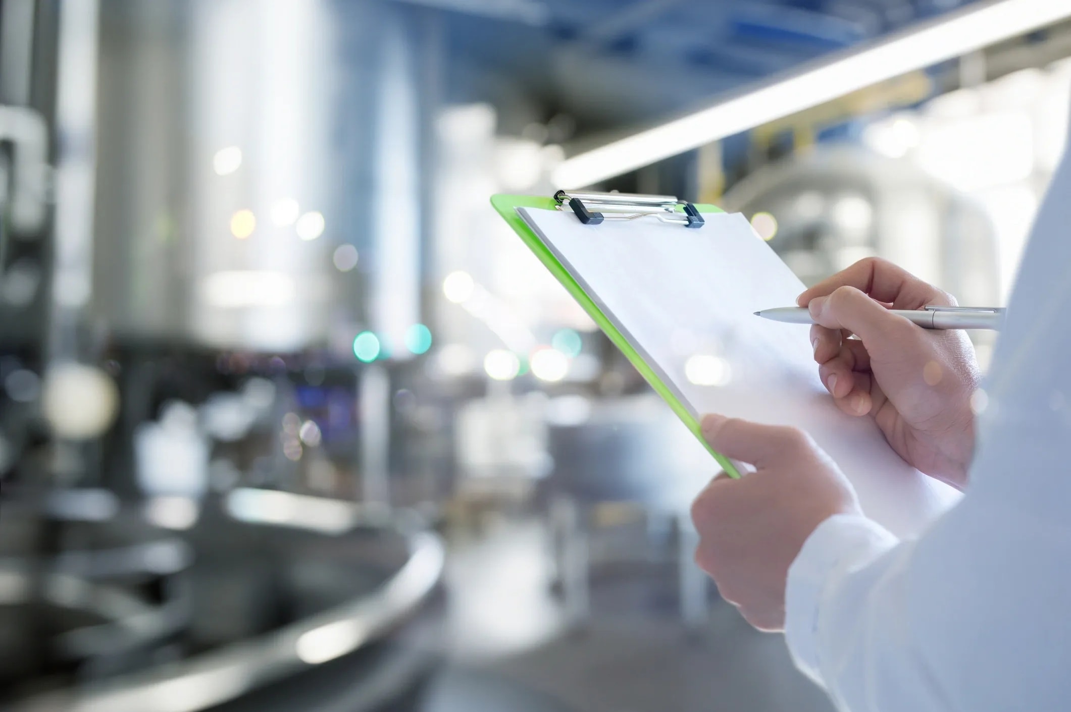 Professional auditor conducting a compliance inspection with a checklist